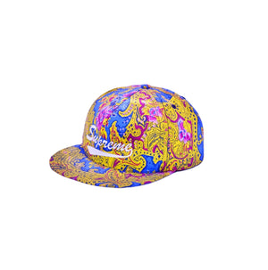 Iconic Supreme baseball cap with white Supreme logo on the front, featuring bold paisley print